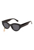 Black cat-eye sunglasses with a small decorative charm 