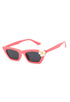 Pink sunglasses with a white flower